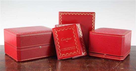 A Pasha de Cartier watch box and instruction booklet and a similar Tank Francaise box with paperwork.